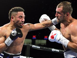 Andre Ward of the US (L) throws a left at Sergey Kovalev of Russia during their WBA, IBF and WBO light heavyweight world championship fight in Las Vegas on November 19, 2016. / AFP PHOTO / John GURZINSKI