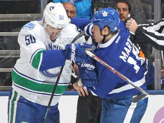 TORONTO, ON - NOVEMBER 5: Brendan Gaunce #50 of the Vancouver Canucks dukes it out against Matt Martin #15 of the Toronto Maple Leafs during an NHL game at the Air Canada Centre on November 5, 2016 in Toronto, Ontario, Canada. The Leafs defeated the Canucks 6-3. (Photo by Claus Andersen/Getty Images)