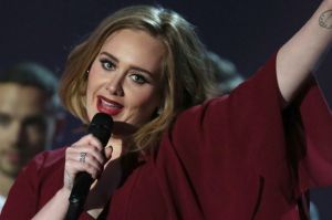 FILE - In this Feb. 24, 2016 file photo, Adele holds the Best British Female Solo Artist award onstage at the Brit ...