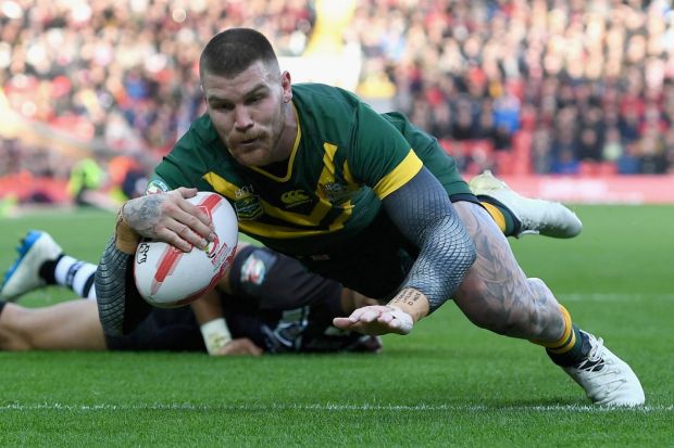 Josh Dugan scores Australia's second try against New Zealand at Anfield on Sunday.