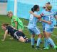 Strike force: Remy Siemsen is congratulated by Leena Khamis and Georgia Yeoman-Dale after scoring Sydney's second goal.