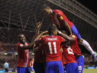 Costa Rica's Christian Bolanos is congratulated by teammates after scoring against United States during a 2018 World Cup qualifying soccer match in San Jose, Costa Rica, Tuesday, Nov. 15, 2016. Costa Rica won the game 4-0. (AP Photo/Moises Castillo)