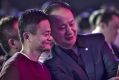 Billionaire Jack Ma, chairman of Alibaba Group (left) smiles for a photograph at the launch of the Singles' Day shopping ...