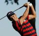 United States? Rickie Fowler hits a shot on the 13th hole during a foresomes match at the Ryder Cup golf tournament ...