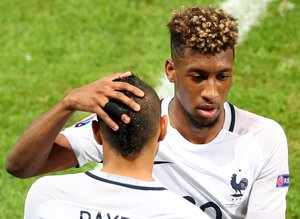 France's Kingsley Coman is replaced by Dimitri Payet during the Euro 2016 Group A soccer match between Switzerland and France at the Pierre Mauroy stadium in Villeneuve d’Ascq, near Lille, France, Sunday, June 19, 2016.