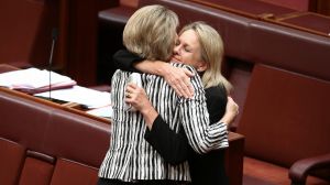 Senator Fiona Nash embraces Senator Michaelia Cash after the Fair Work (Registered Organisations) Amendment Bill 2014 ...