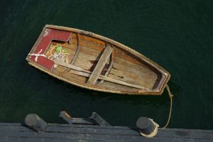 Moored dinghy by the jetty.