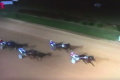 Not even close: A track invader beats the horses across the line.