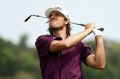 Aiming high: Aaron Baddeley fires at the 15th pin during Saturday's third round.