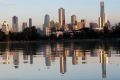 Albert Park Lake reflects the city with a pink hue.