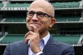 Microsoft chief executive Satya Nadella talking to James Sutherland and Glenn Maxwell at the MCG.