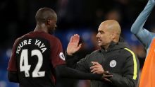 Manchester City's Yaya Toure, who scored both their goals, celebrates with his head coach Pep Guardiola after the ...