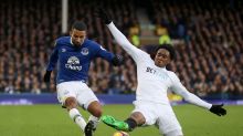 Everton's Aaron Lennon, left, and Swansea City's Leroy Fer battle for the ball during the English Premier League soccer ...
