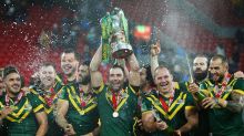 Cameron Smith lifts the trophy with team mates after victory in the Four Nations Final.