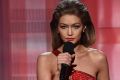 Gigi Hadid impersonates Melania Trump alongside co-host Jay Pharoah during the 2016 American Music Awards on Sunday in ...