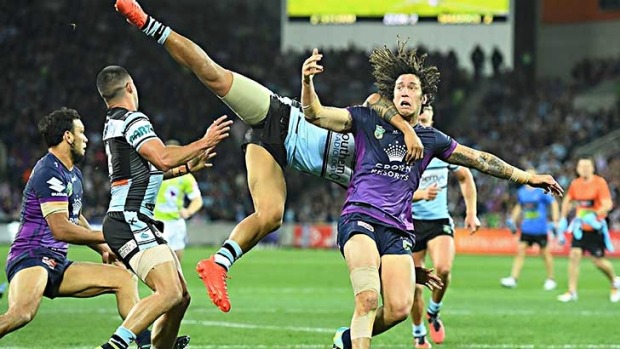 MELBOURNE, AUSTRALIA - SEPTEMBER 03:  Kevin Proctor of the Storm is tackled  by Sosaia Feki of the Sharks
during the ...