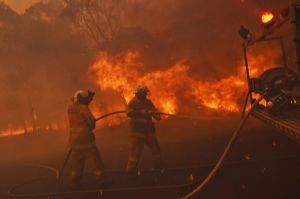 Firefighters face strong winds fanning an out of control fire in Sydney's west.