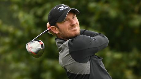 WATFORD, ENGLAND - OCTOBER 15: Chris Wood of England hits his tee shot on the third hole during the third round of the ...