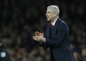 Arsenal's manager Arsene Wenger applauds his players 