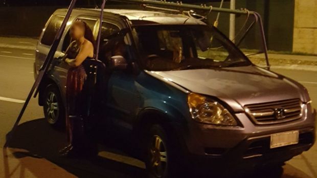 A woman was pulled over by police after they found her driving around with a swing set attached to her vehicle.