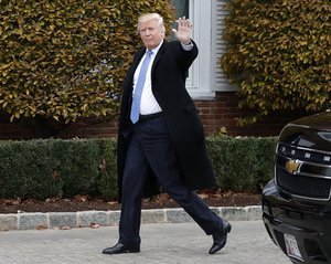 President-elect Donald Trump waves as he arrives at the Trump National Golf Club Bedminster clubhouse, Sunday, Nov. 20, 2016, in Bedminster, N.J.