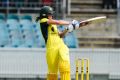 Ellyse Perry hits a four