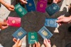 Why is every passport in the world said to feature a varying shade of either red, green, black or blue?