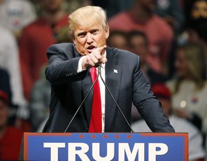 Republican presidential candidate Donald Trump gestures during a speech to a rally in Oklahoma City, Friday, Feb. 26, 2016.