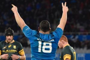 Shock upset: Italy's Simone Ferrari, celebrates the victory over the Springboks.