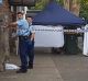 Police cordon off a footpath in Campsie where a man was stabbed to death.