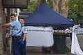 Police cordon off a footpath in Campsie where a man was stabbed to death.