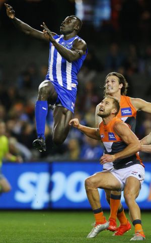 Kangaroo Majak Daw flies for the footy during North Melbourne's loss to GWS.