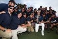 Spotlight: Jordan Spieth poses with greenkeeping staff and the Stonehaven trophy after winning the 2016 Australian Open ...