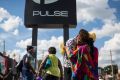 Wayne Dominici, 23, cries on the shoulder of his aunt, Ada Dominici, at a memorial outside Pulse, the gay nightclub ...