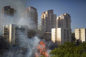 A fire burns in Haifa, Israel, Thursday, Nov. 24, 2016. Israeli police have arrested four Palestinians in connection with one of several large fires that damaged homes and prompted the evacuation of thousands of people in the past few days.