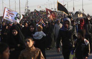 Shiite pilgrims make their way to Karbala for Arbaeen, in Basra, 340 miles (550 kilometers) southeast of Baghdad, Iraq - Period after the anniversary of the 7th century martyrdom of Imam Hussein, the Prophet Muhammad's grandson