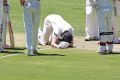 Adam Voges of the Warriors sinks to his knees after being struck in the head by a bouncer from Cameron Stevenson.