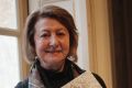 Art historian and Van Gogh specialist Bogomila Welsh-Ovcharov poses with the book <i>Vincent Van Gogh: The Lost Arles ...