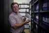 Richmond River Philatelic Society vice-president Geoff Wotherspoon holds photo of a plane