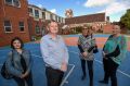Sacred Heart Primary School principal Tony Crosbie, with (from left) school parents Vanessa Raymond, Nicole Kingston and ...
