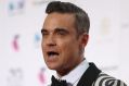 Robbie Williams avoided the downpours at the ARIA Awards in Sydney on Wednesday.