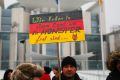 The 'International Convention of German Russians' protest against sexual assaults by migrants in Berlin. The sign reads ...