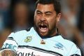 SYDNEY, AUSTRALIA - SEPTEMBER 23: Cowboys captain Johnathan Thurston reacts as Andrew Fifita of the Sharks celebrates a ...