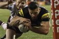 Josh Mansour crosses the line for the first of the Panthers' six tries.