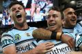 Party time: Chad Townsend, James Maloney and Valentine Holmes celebrate. 