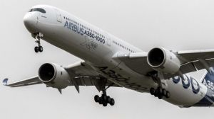 The Airbus A350-1000 comes into land following its first flight at the Airbus factory in Toulouse, France, on Thursday.