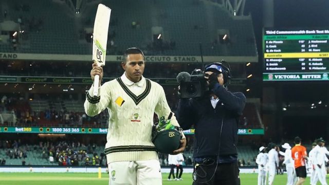 Impressive: Usman Khawaja is applauded off the field after his century on day two.