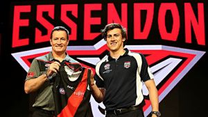 SYDNEY, AUSTRALIA - NOVEMBER 25:  Essendon Football Club head coach John Worsfold poses for a photo with the number one ...