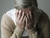 Stress alzheimers - Senior woman covering face with her hands