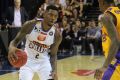 Brisbane import Torrey Craig sizes up the defence of Kings import Greg Whittington on his way to 18 points.